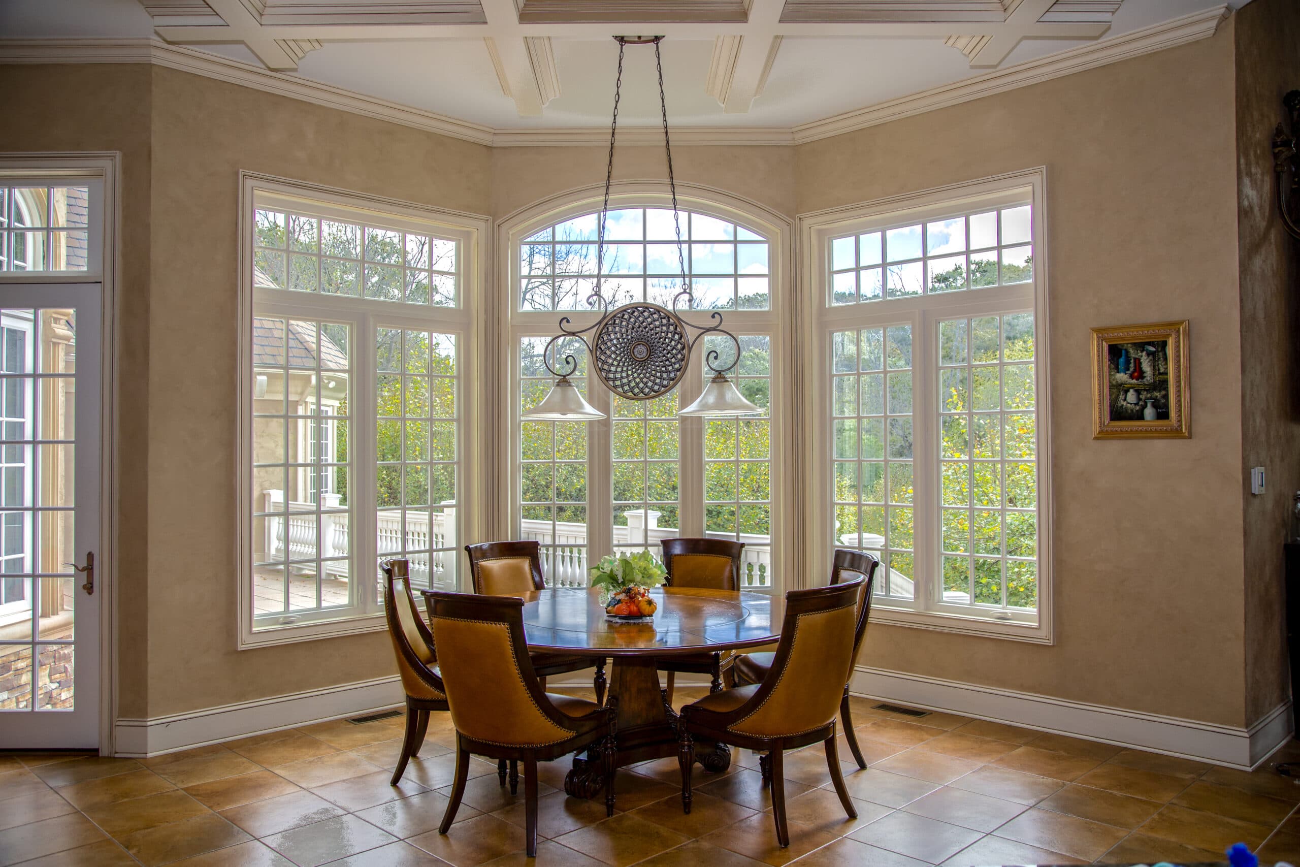 Floor-to-ceiling casement windows in a lovely dining area