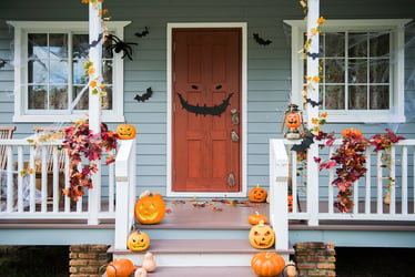 front windows and doors decorated with Halloween