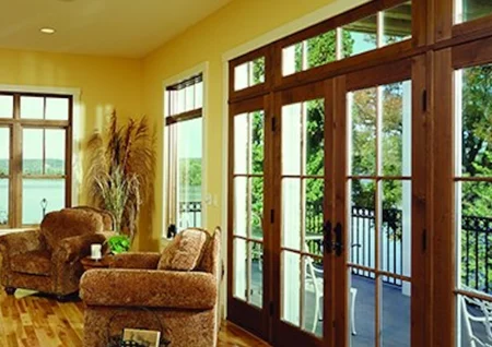 Multiple wood-framed patio doors leading to deck