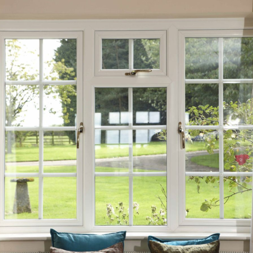 Living room with three white casement windows