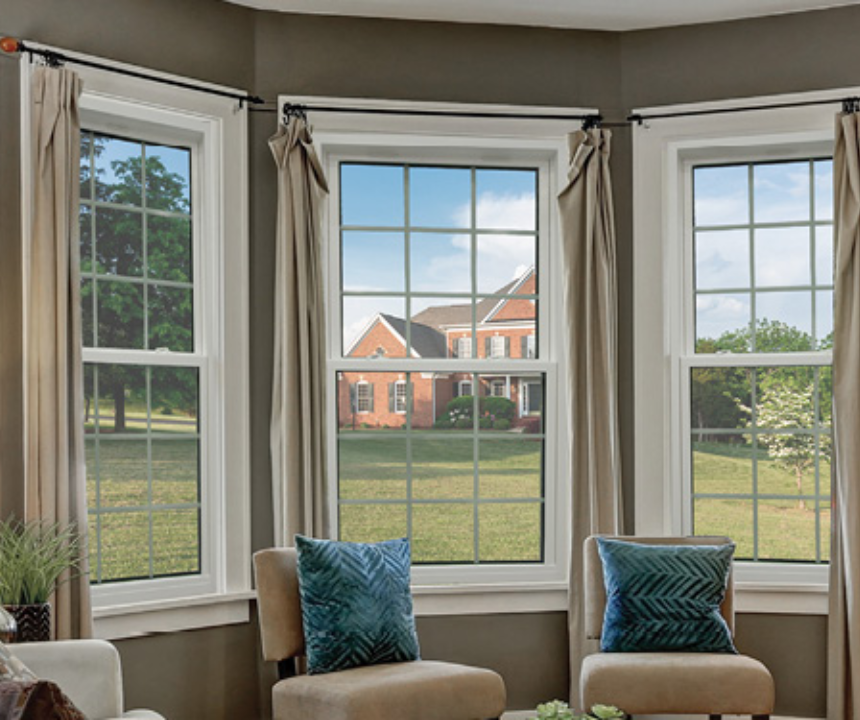 Arched bow window with cushioned seat and garden view