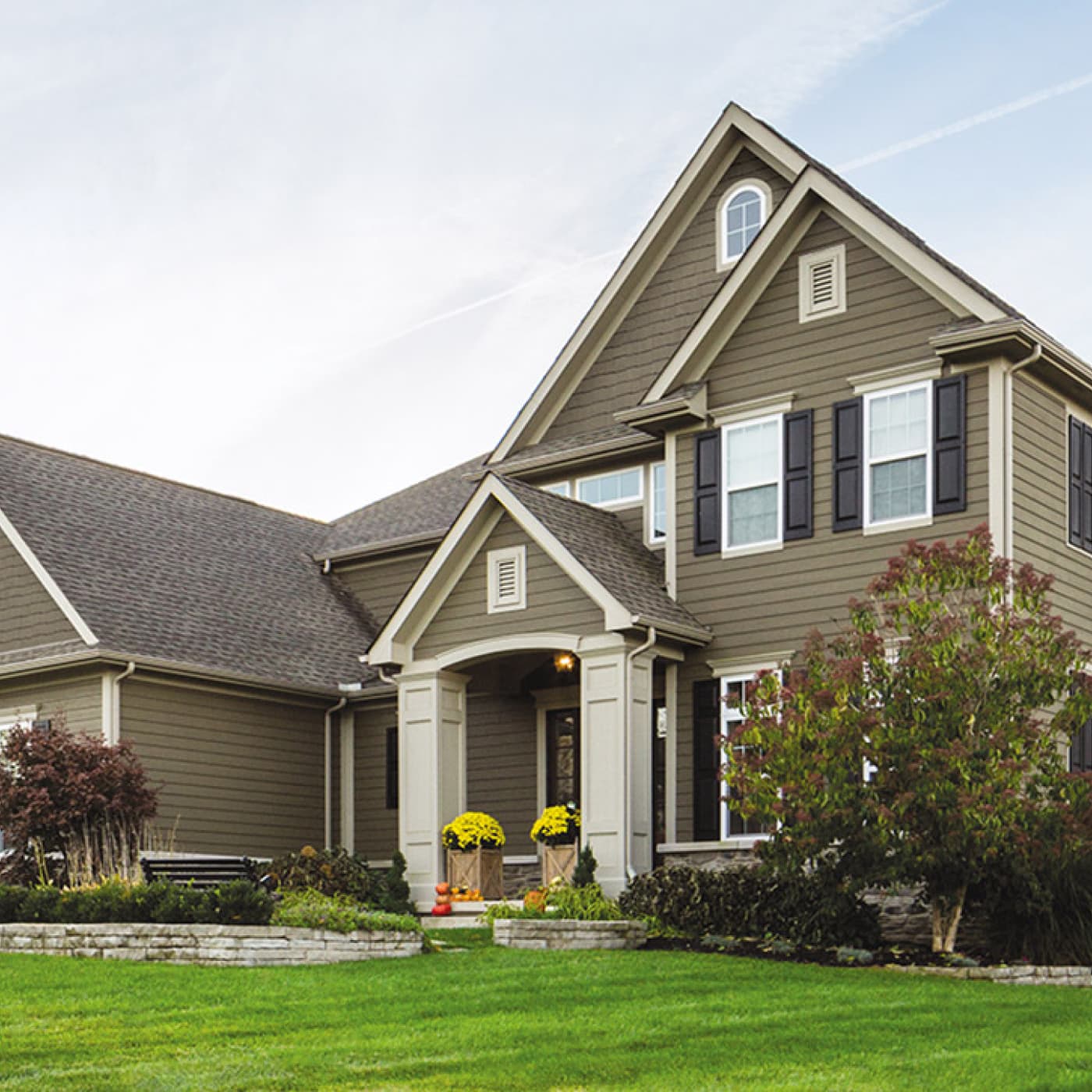 Two-story house with taupe LP SmartSide lap siding
