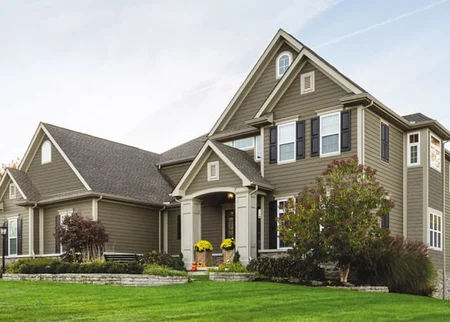 Two-story house with taupe LP SmartSide lap siding