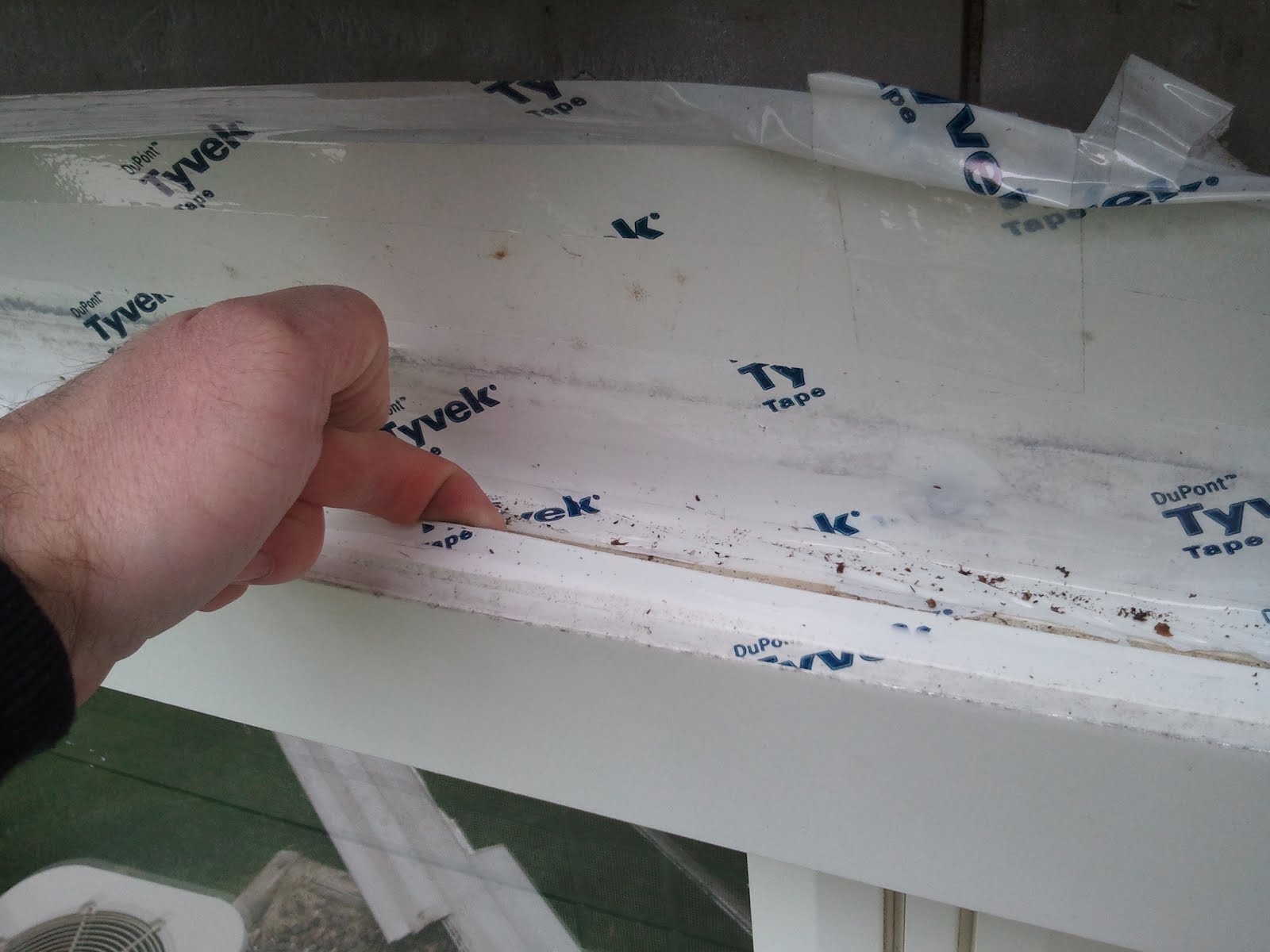 poor window installation of Tyvek flashing