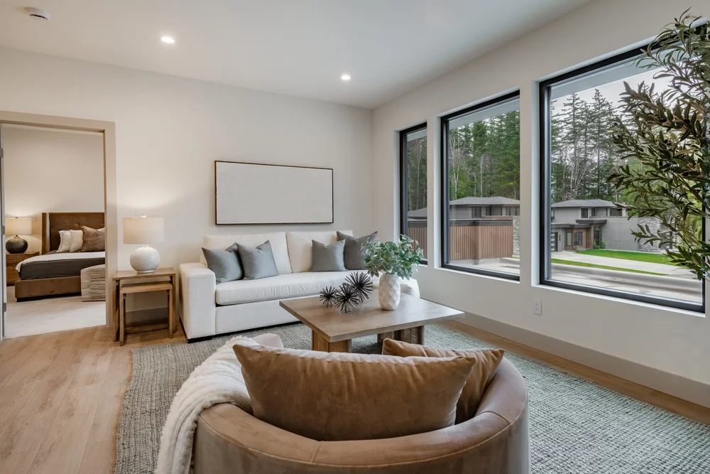 A luxury home with three large windows.
